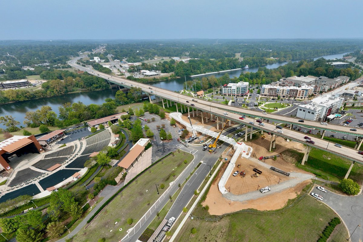 tuscaloosacity's tweet photo. 👀 sneak peek 👀

The pedestrian bridge over Jack Warner Pkwy made a leap towards completion today as the full piece across the road was loaded in. 😮 This bridge will connect @TheSabanCenter to River District Park + improve pedestrian access between the riverfront and downtown! https://t.co/oKbM1D2VTR