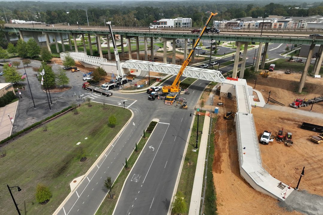 tuscaloosacity's tweet photo. 👀 sneak peek 👀

The pedestrian bridge over Jack Warner Pkwy made a leap towards completion today as the full piece across the road was loaded in. 😮 This bridge will connect @TheSabanCenter to River District Park + improve pedestrian access between the riverfront and downtown! https://t.co/oKbM1D2VTR