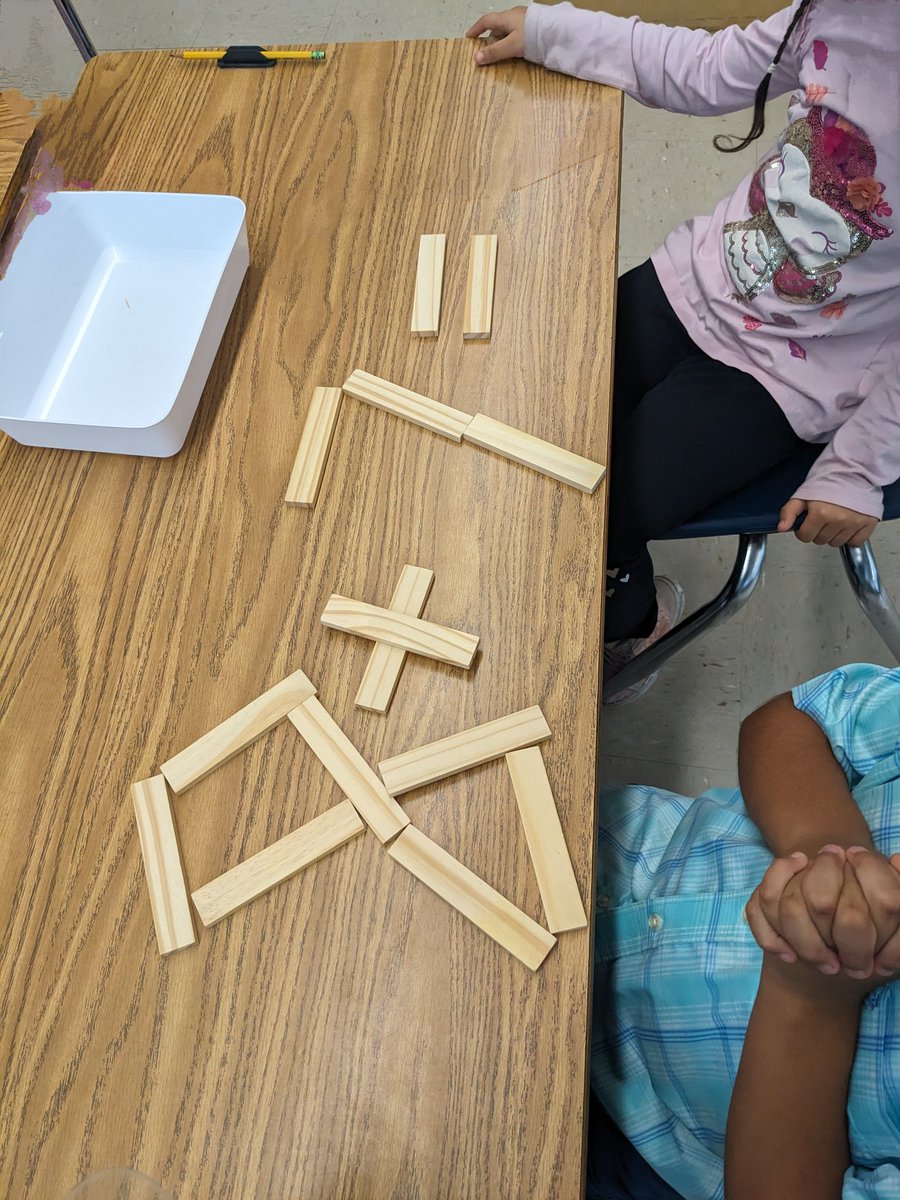 Students using <a href="/KEVAplanks/">KEVA® Planks</a> to create number sentences in first grade.