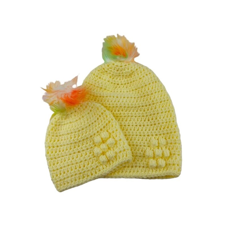 Mummy and me matching ladies and baby lemon crocheted hats with flower detail and detachable white faux fur pompoms with green & orange tips etsy.me/3ECcAza #knittingtopia #etsy #handmade #tweetuk #etsyRT #mummyandbaby #pompomhats #ladieshat #babyhat #babyclothes