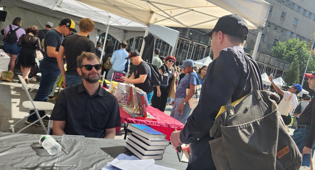 The @BKBF was exciting for me as a both writer and a reader this past Sunday. I met John Wray, the author of 'Gone to the Wolves' @MacmillanUSA. He autographed my notebook! Wray's novel depicts a group of teenagers losing themselves in the heavy metal subculture. I could relate.