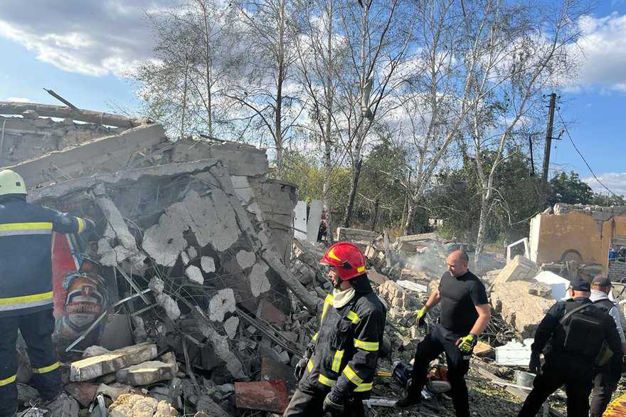 IuliiaMendel's tweet photo. Around 50 bodies were taken out from under the rubble after Russians shelled a cafe and a groceries shop in Kharkiv region. When next time someone thinks about "wrong Zelenskyy" for some reasons, recollect this. It is not about politics. It is about insanity and horrible brutality of Russian army, Putin and mindset of all who support this... #StopRussianAggression