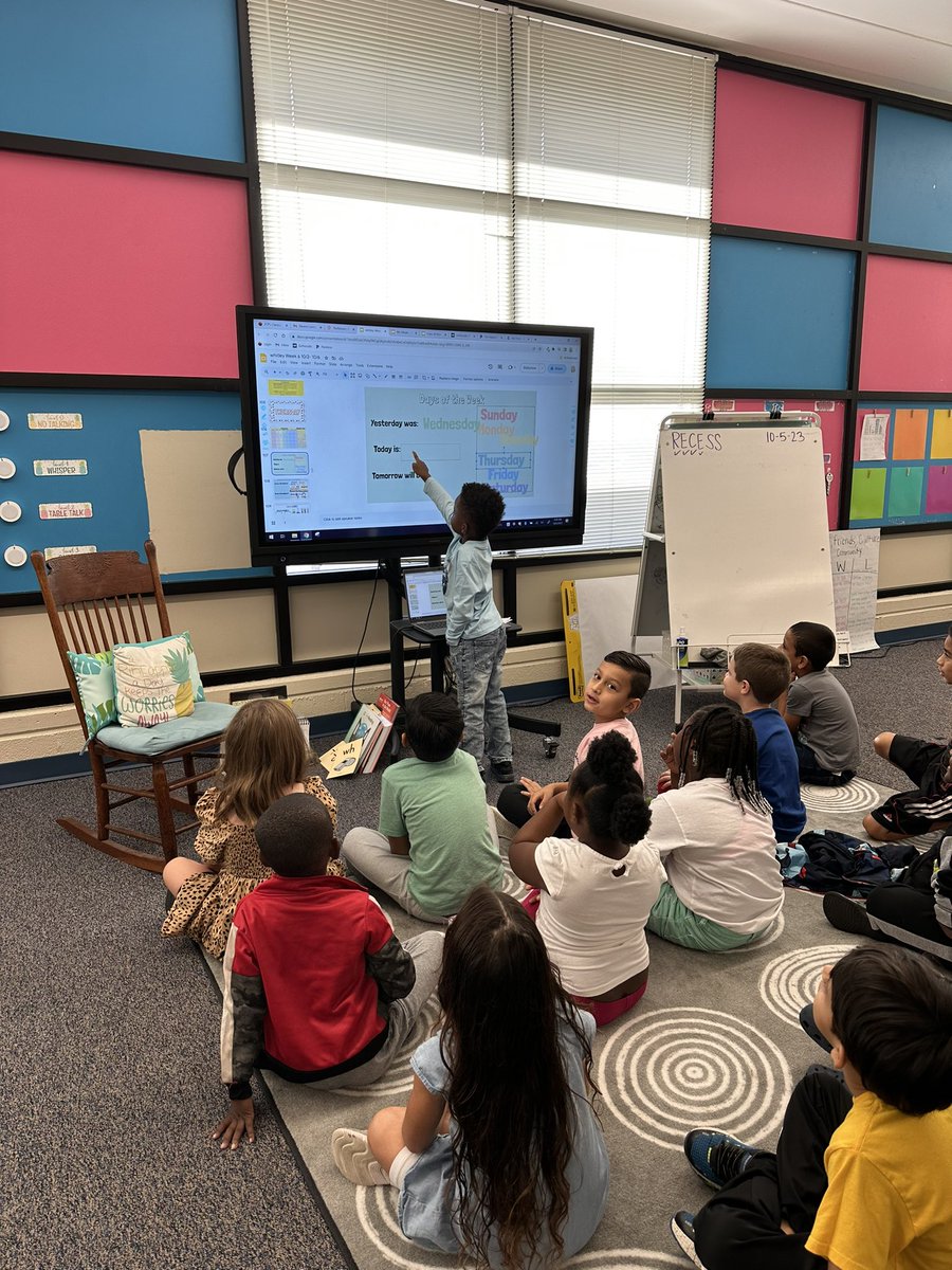 Tiny teacher of the day leading our calendar time!