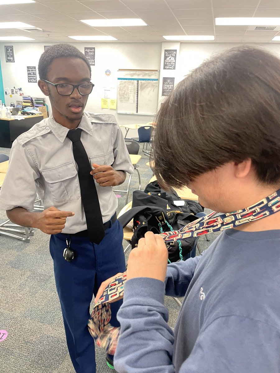 EastLeeCountyHS's tweet image. Our East Lee County High School Jaguars are not just about academics; they're about learning valuable life skills too! #ModelMen showing their classmate how to tie a tie. Empowering each other with style and knowledge. 👔 👏#LifeSkills #Teamwork #JaguarPride