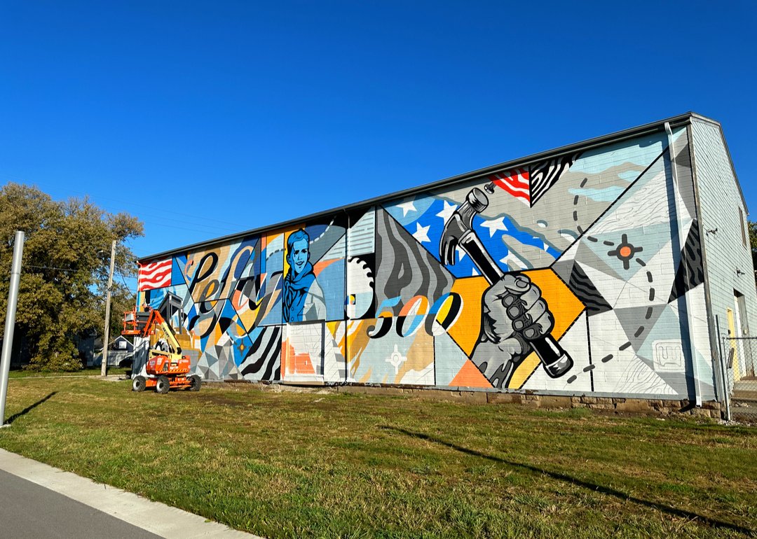CityofCB's tweet photo. More mural progress! Weston Thomson's mural is called "Dream Builder" and is located on the FIRST AVE facing wall at 29 S 21st St, just east of Cochran Park. Check it out! #firstavecb #councilbluffs #unleashcb https://t.co/fpB3bURwkx