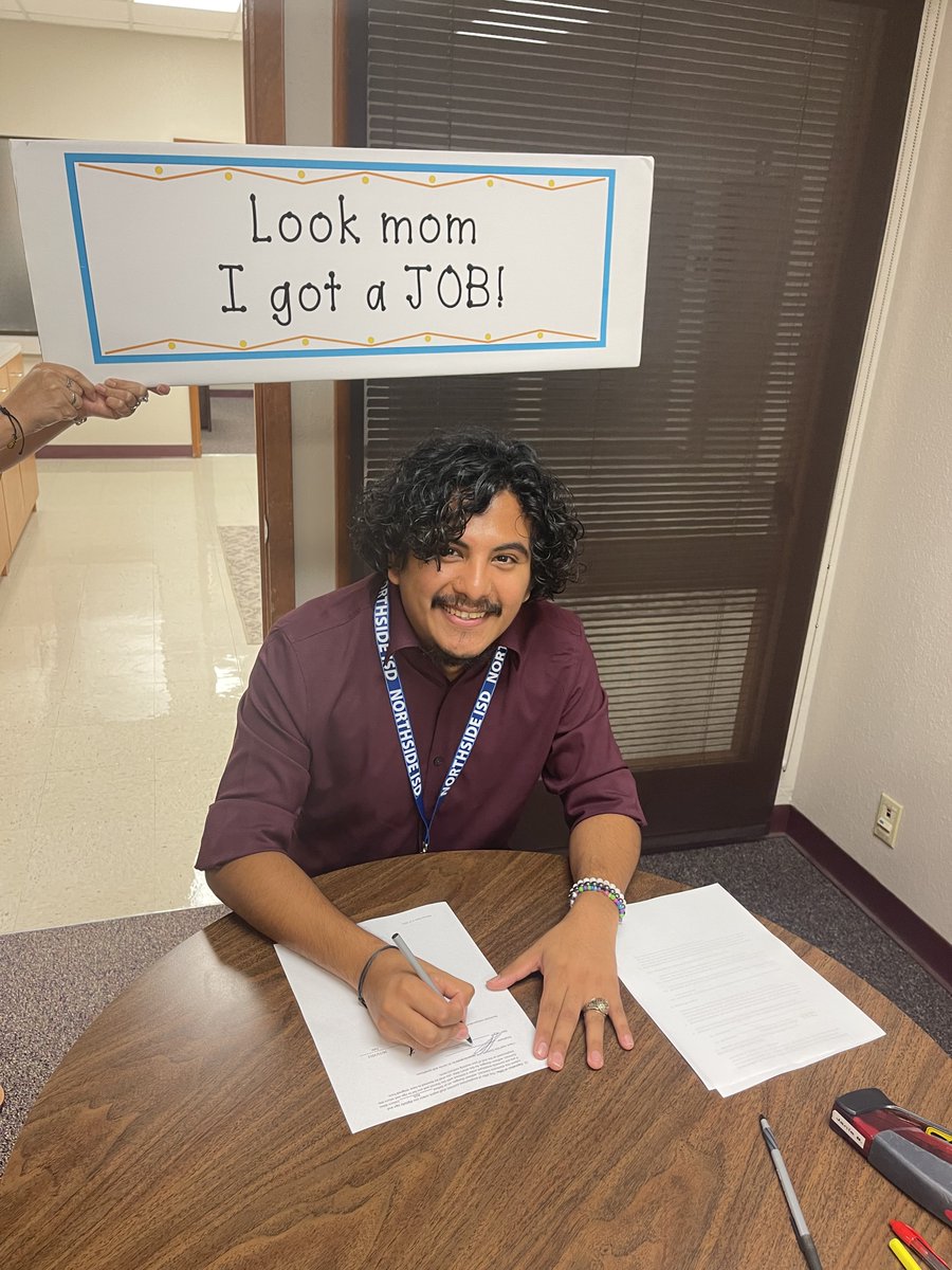 The joy of joining the greatest District in Texas.  New hire Arturo Toledo, English teacher from Brennan HS signing his contract.