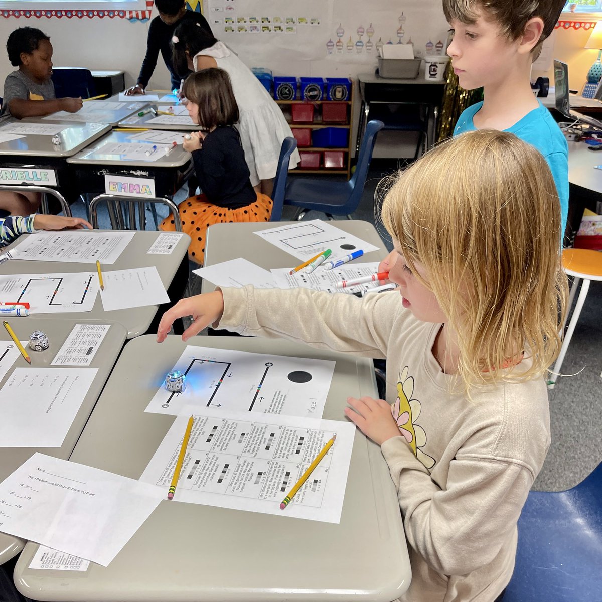 jebuskey's tweet photo. Students running robots to see if their codes match the correct math problems. #unlockingthemagic #odellprimary https://t.co/aGdWYa3LLK