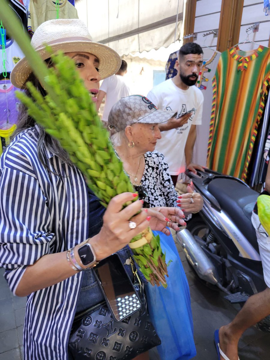 "Amidst the lively Medina, we shared the timeless tradition of shaking the lulav with fellow travelers—a glimpse of our heritage in a vibrant world. 🌍🌿 #SukkotInMedina #CultureCrossroads"