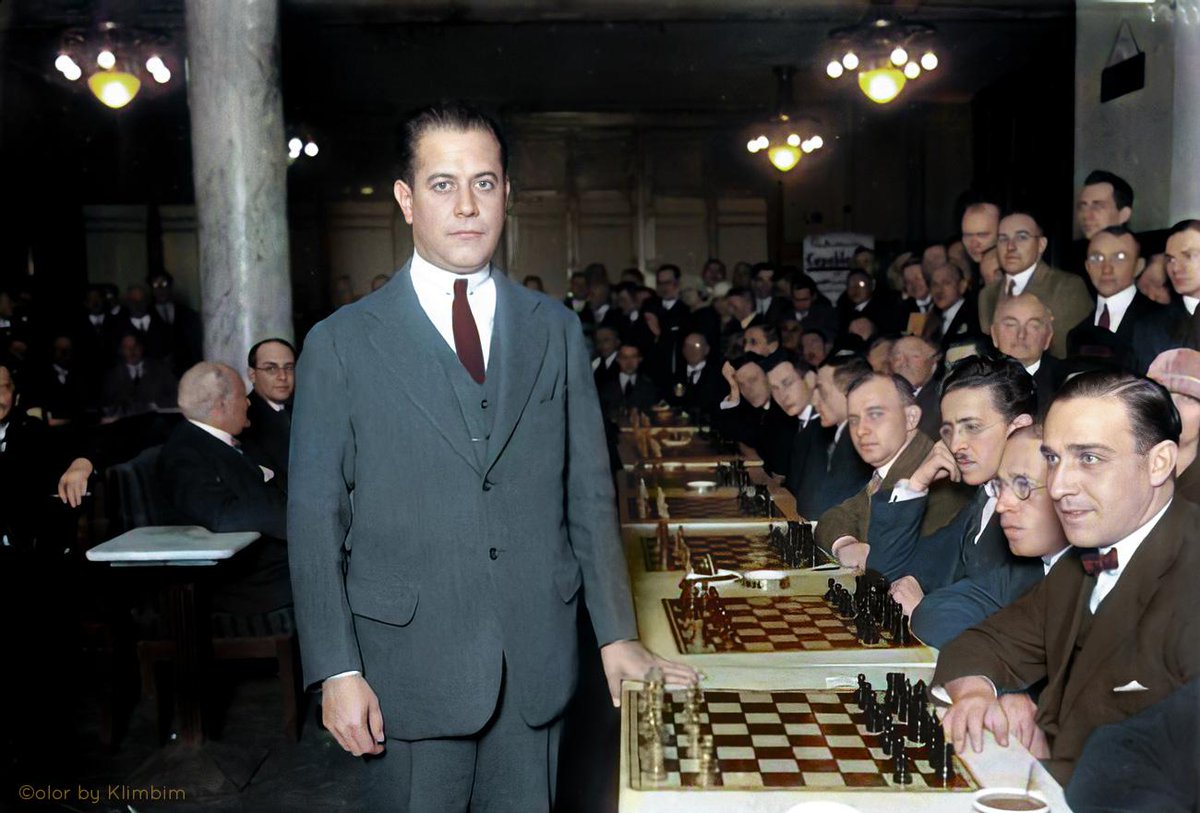 chessinstories's tweet photo. A Capablanca Story

The late world champion Jose Raul Capablanca mentioned a story in Germany:

I was playing in a tournament in Germany one year when a man approached me.  Thinking he just wanted an autograph, I reached for my pen, when the man made a startling announcement.  'I've solved chess!'  I sensibly started to back away, in case the man was dangerous as well as insane, but the man continued: 'I'll bet you 50 marks that if you come back to my hotel room I can prove it to you.'  Well, 50 marks was 50 marks, so I humored the fellow and accompanied him to his room...

Back in the room, we sat down at his chess board.  'I've worked it all out, white mates in 12 no matter what.'  I played black perhaps a bit incautiously, but I found to my horror that white's pieces coordinated very strangely and that I was going to be mated on the 12th move!

I tried again, and I played a completely different opening that couldn't possibly result in such a position, but after a series of very queer-looking moves, once again, I found my king surrounded, with mate to fall on the 12th move.  I asked the man to wait while I ran downstairs and fetched Emmanuel Lasker, who was world champion before me.  He was extremely skeptical, but agreed to at least come and play.  Along the way we snagged Alekhine, who was then world champion, and the three of us ran back up to the room...

Lasker took no chances, but played as cautiously as could be, yet after a bizarre, pointless-looking series of maneuvers, found himself hemmed in a mating net from which there was no escape.  Alekhine also tried his hand, too, but also to no avail.

It was awful!  Here we were, the finest players in the world, men who had devoted our very lives to the game, and it was all over!  The tournaments, the matches, everything - chess had been solved, white win in a dozen or so moves!

About this time Capa's friends would break in, saying "Wait a minute, I never heard anything about all this!  What happened?"

"Why... we killed him, of course..."

📷 Capa giving a 30 boards simul in Berlin, June 1929.