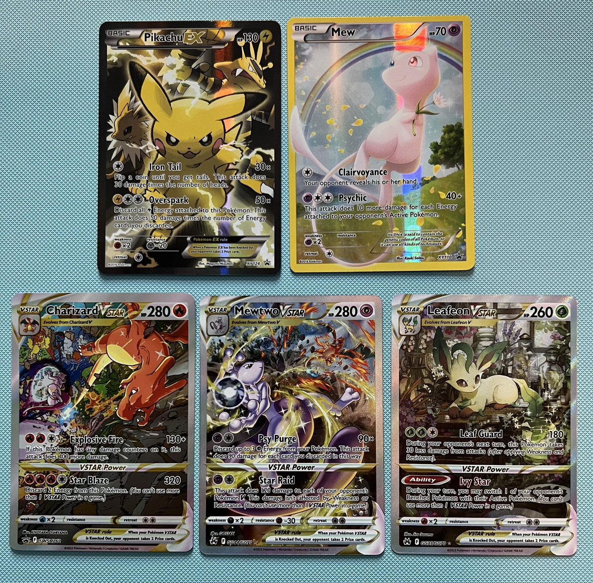 JS_1393's tweet image. Some favourites 👌🔥 Anyone notice the charizard promo &amp;amp; mewtwo is the same battle scene from different perspectives 👀 #pokemon #charizard #mewtwo #mew #pikachu #leafeon