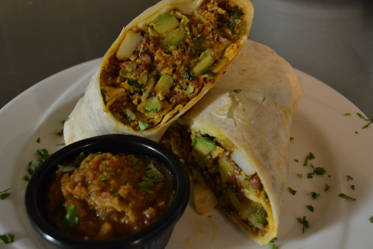 woods_uncle's tweet photo. Rise and shine with the ultimate Breakfast Burrito! 
 Packed with chorizo, avocado, egg, cheese, jalapeno, cilantro, and homemade salsa, it's a breakfast dream come true!  
#BreakfastBurrito #MorningFuel https://t.co/kdubDHQ3mM