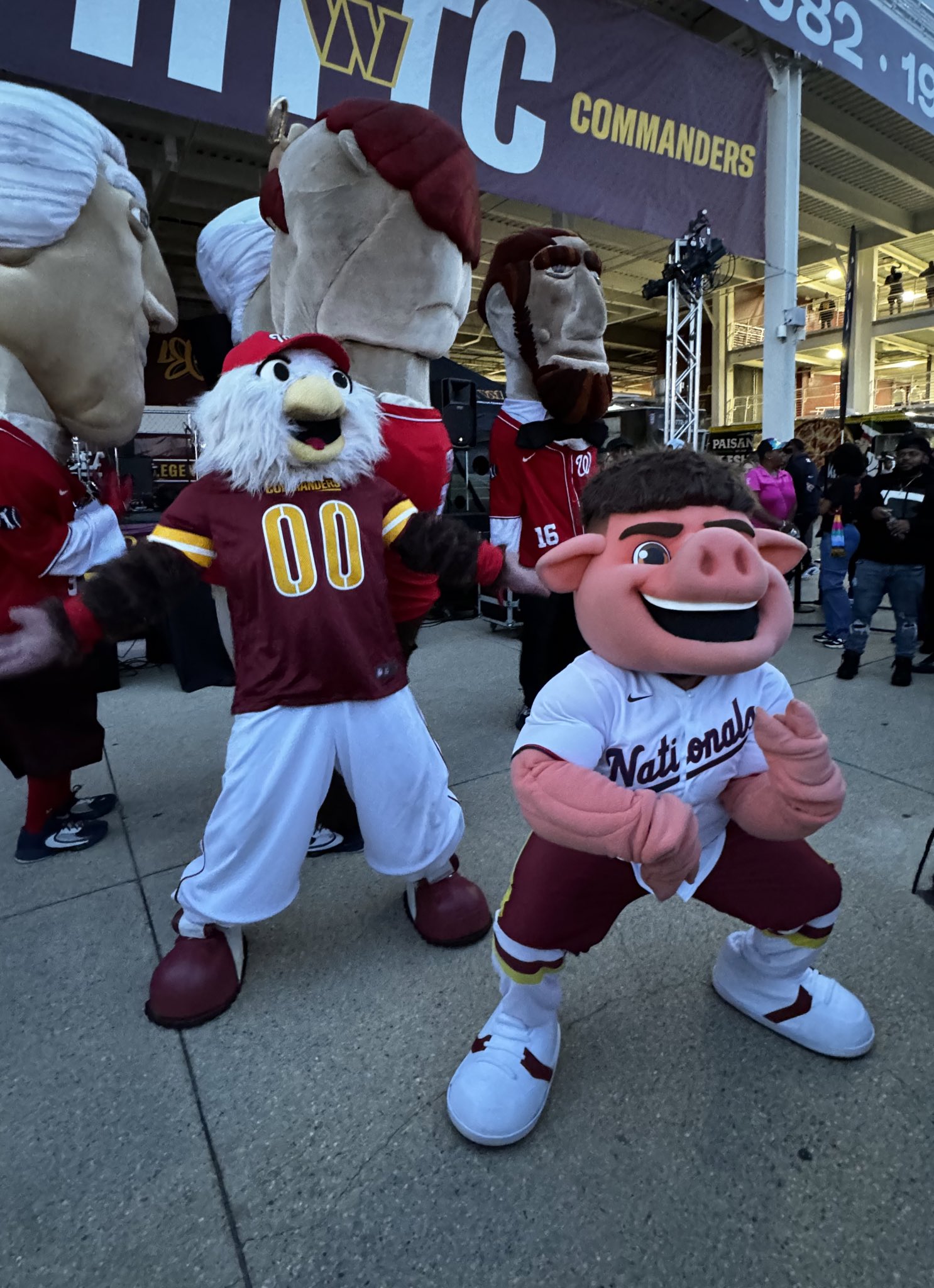 WASHINGTON, DC - APRIL 29: The Nationals bald eagle Mascot Screech dances  in his Cherry Blossom City Connect jersey and fedora hat during the  Pittsburgh Pirates versus Washington Nationals MLB game 2