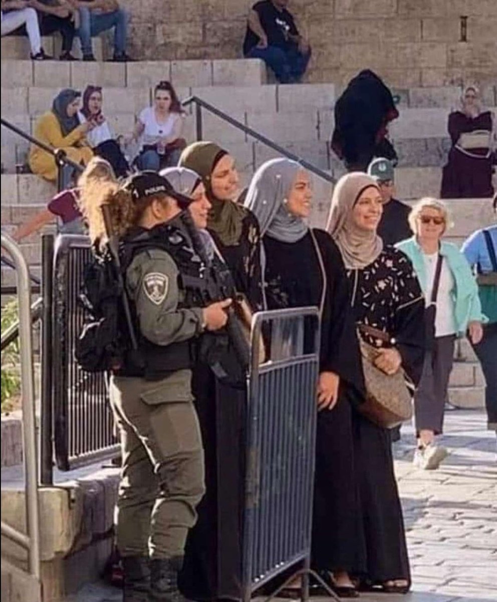ShuratHaDin's tweet photo. Muslim women take a picture with Israeli border police officers in Jerusalem. 

They know very well that they protect them, too, against radicalism. https://t.co/ixlvrb7CFR