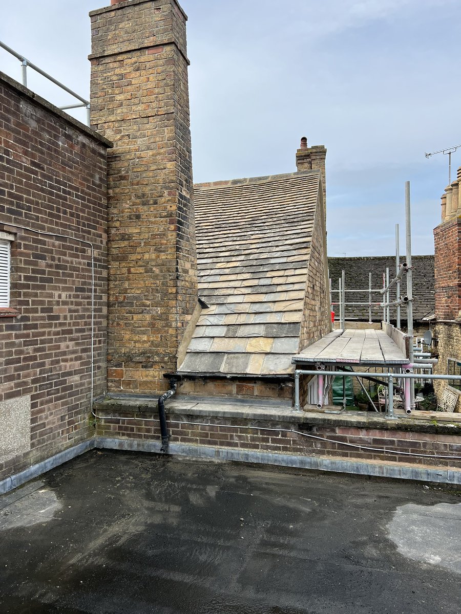 Collyweston slate roof completed at #Superdrug in Stamford. Mixing in new slate with reclaimed slate.