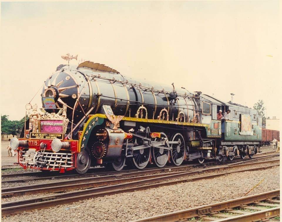 Have you seen a more beautifully adorned WP than this? This is WP 7715 decorated by the Daund Loco shed for the Black Beauty competition, sometime in the late 1970s or early 1980s. This relatively new steam locomotive was manufactured by CLW in 1966. <a href="/SachinKalbag/">Sachin Kalbag</a> <a href="/somnath1978/">Somnath Mukherjee</a>