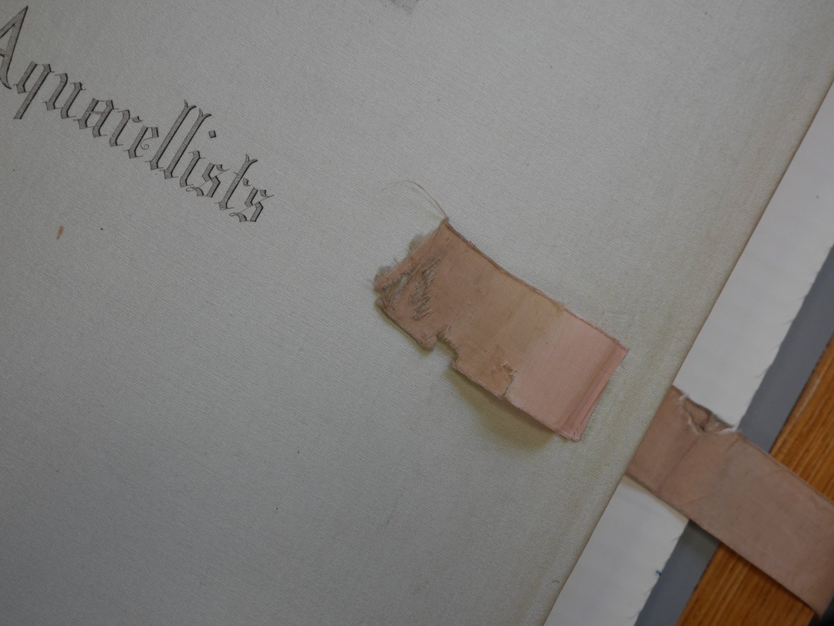 theUL's tweet image. Deborah Farndell, Senior Conservator, carefully conserved these C19th catalogues from The Society of French Aquarellists. Bespoke enclosures protect the original silk ribbons from being crushed #CULconservation #TextileConservation #BookConservation #CambridgeUniversityLibraries