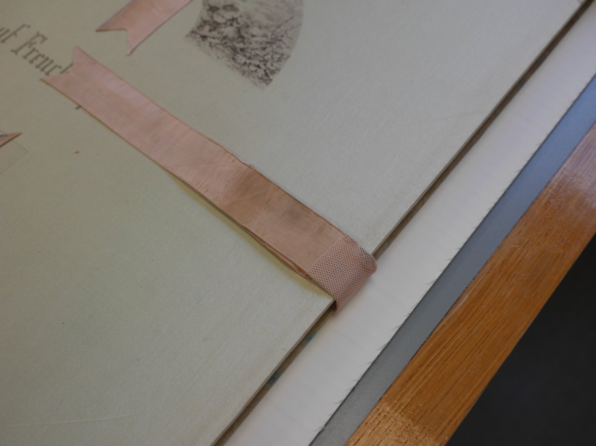 theUL's tweet image. Deborah Farndell, Senior Conservator, carefully conserved these C19th catalogues from The Society of French Aquarellists. Bespoke enclosures protect the original silk ribbons from being crushed #CULconservation #TextileConservation #BookConservation #CambridgeUniversityLibraries