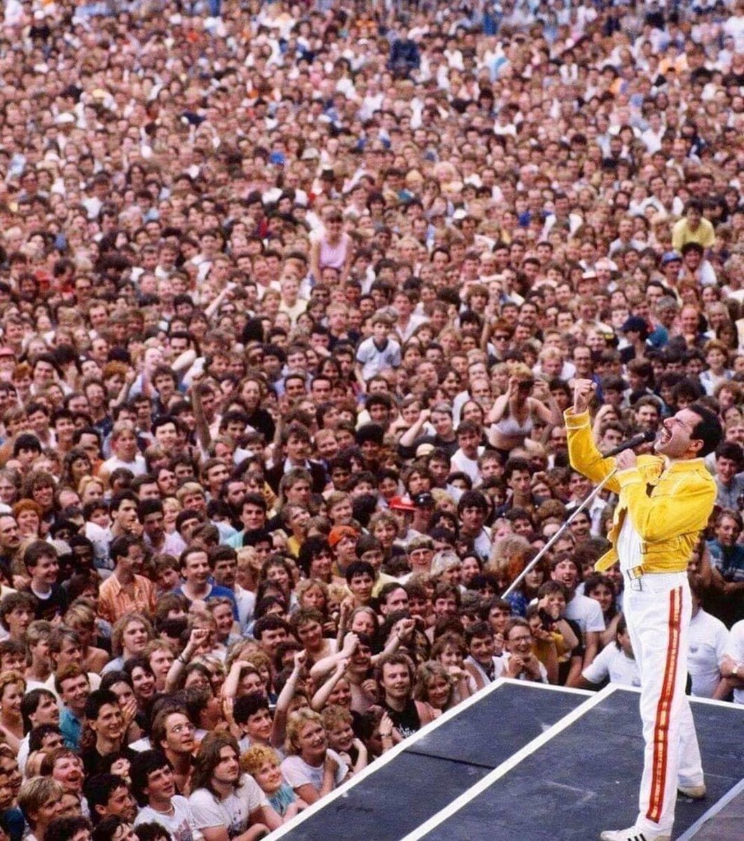 Freddie Mercury at Wembley, 1986. No phones, no cameras.... people are just enjoying the moment!