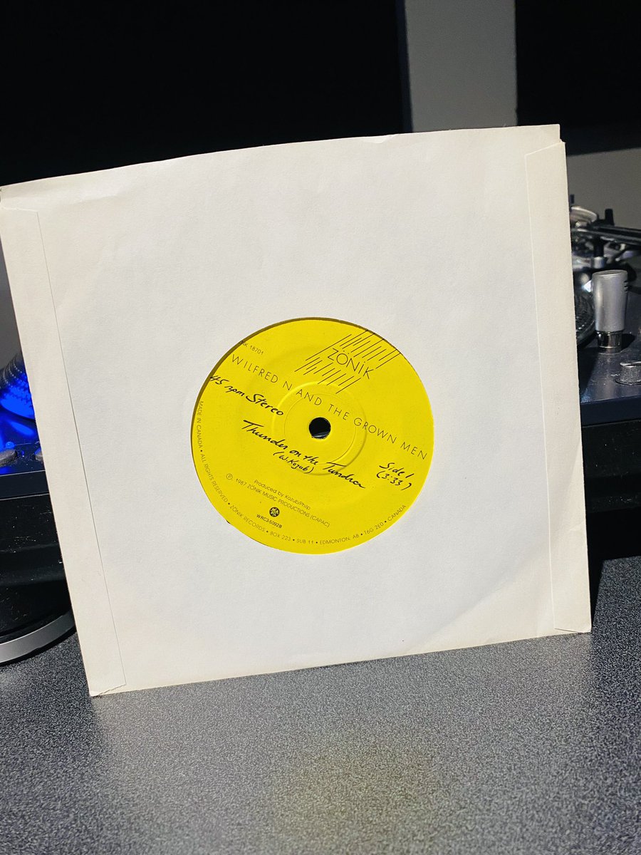 GrantStovel's tweet photo. If you look VERY CLOSELY at the label of this 1987 @wngm 45, you can see that Wilf wrote the #s 1 &amp; 2 by hand. He had that part of the label left blank, do he could select the A Side based on which radio station he was sending ‘em to! For @ckuaradio, it was Thunder On The Tundra. https://t.co/zOcB3z4etv