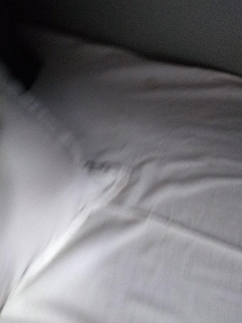 abhijitzero's tweet photo. @nerailwaygkp @RailNf @RailMinIndia @IRCTCofficial @RailwaySeva Boarded NTSK to Bangalore at train no. 22502 at 1st AC.....Got soiled bed cloth and pillow cover....Even taking so much for for services if the the same doesn't improve then there is no point in providing the same. https://t.co/uJY96ocjUl