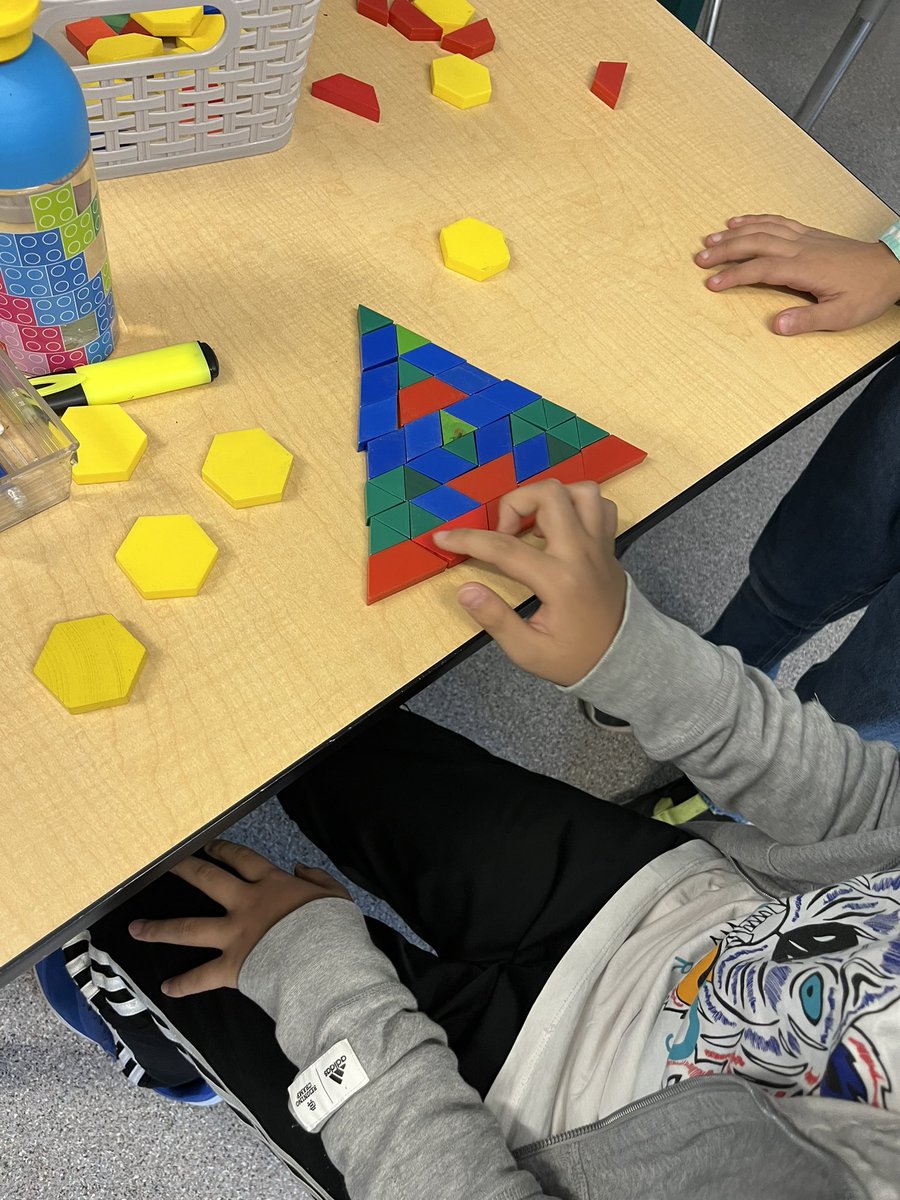morikkey1's tweet image. Grade 5 used their thinking skills creating triangles with various # of shapes. Thx @MathforLove for the engaging idea. #joyfullearning #everyonecandomath