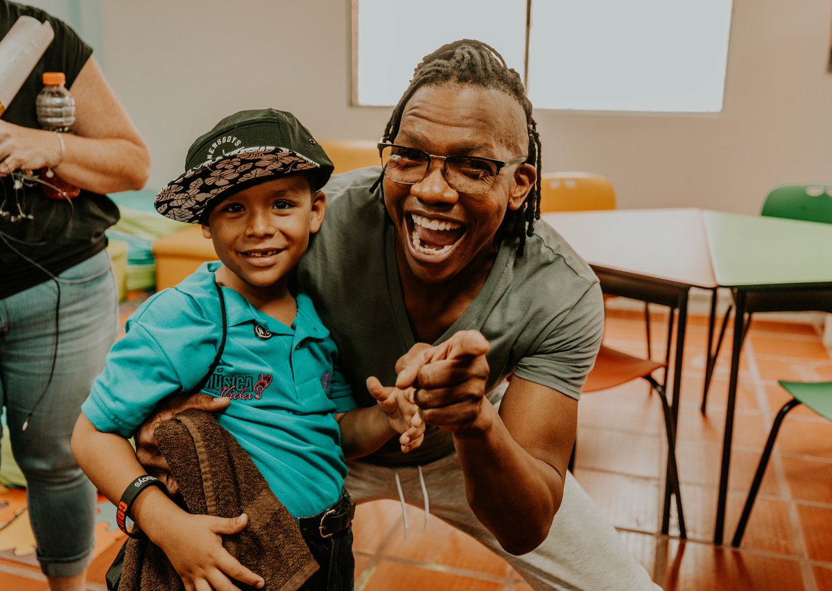 newsboys's tweet photo. Happy World Smile Day! 😁🎉

We’re smiling about the impact we are making together with our friends Children International for children like Mateo, who we got to spend some time with on our recent trip to Colombia! We hope you find a million reasons to smile today! https://t.co/7KkBJtR3Ih