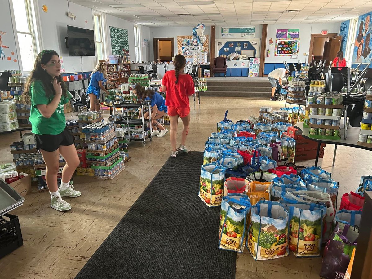 We were WOWED beyond belief when the caravan of vehicles rolled onto Cameron's grounds filled with canned goods and other non-perishable items this yesterday afternoon!  The huge donation was a part of Our Lady of Mercy's High School Spirit Day.