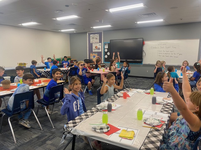 At Anthem School fall is for pumpkins, picnics and READING!  Our 3rd grade enjoying their indoor picnic reading their sandwich books they made.