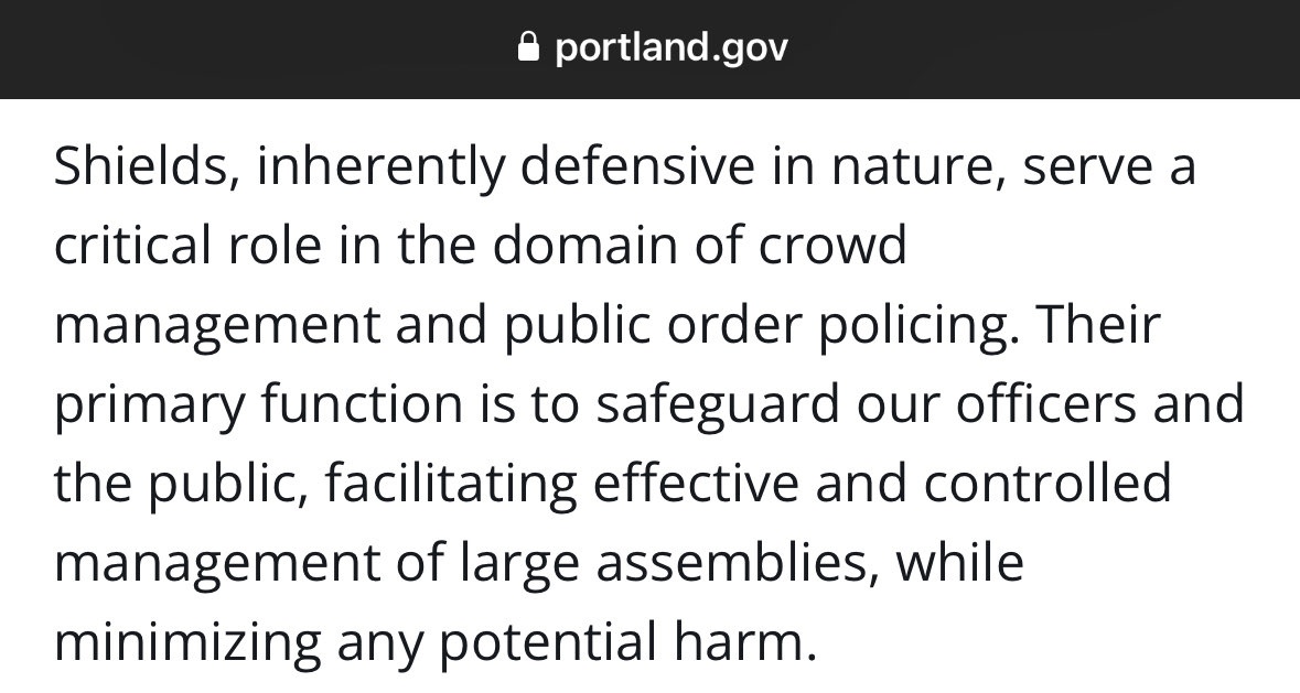 apparently; round, padded shields in the hands of protestors = an indicator that someone plans to fight square, hard plastic shields in the hands of cops = inherently defensive ... sure ok