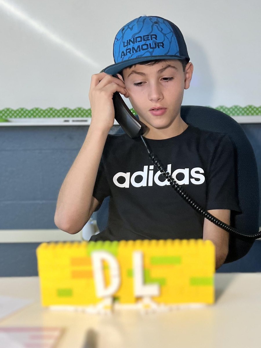 PowderMillRocks's tweet photo. Sixth grader Brennen P. showed his Digital Literacy teacher, Ms. Fugiel, just how much he appreciated her.  Brennen created a custom Lego phone holder with a DL logo and moving arms. You inspired us, Brennen, with your creative genius! #BeGOLD #PowderMillROCKS https://t.co/HFEZ91HyRF