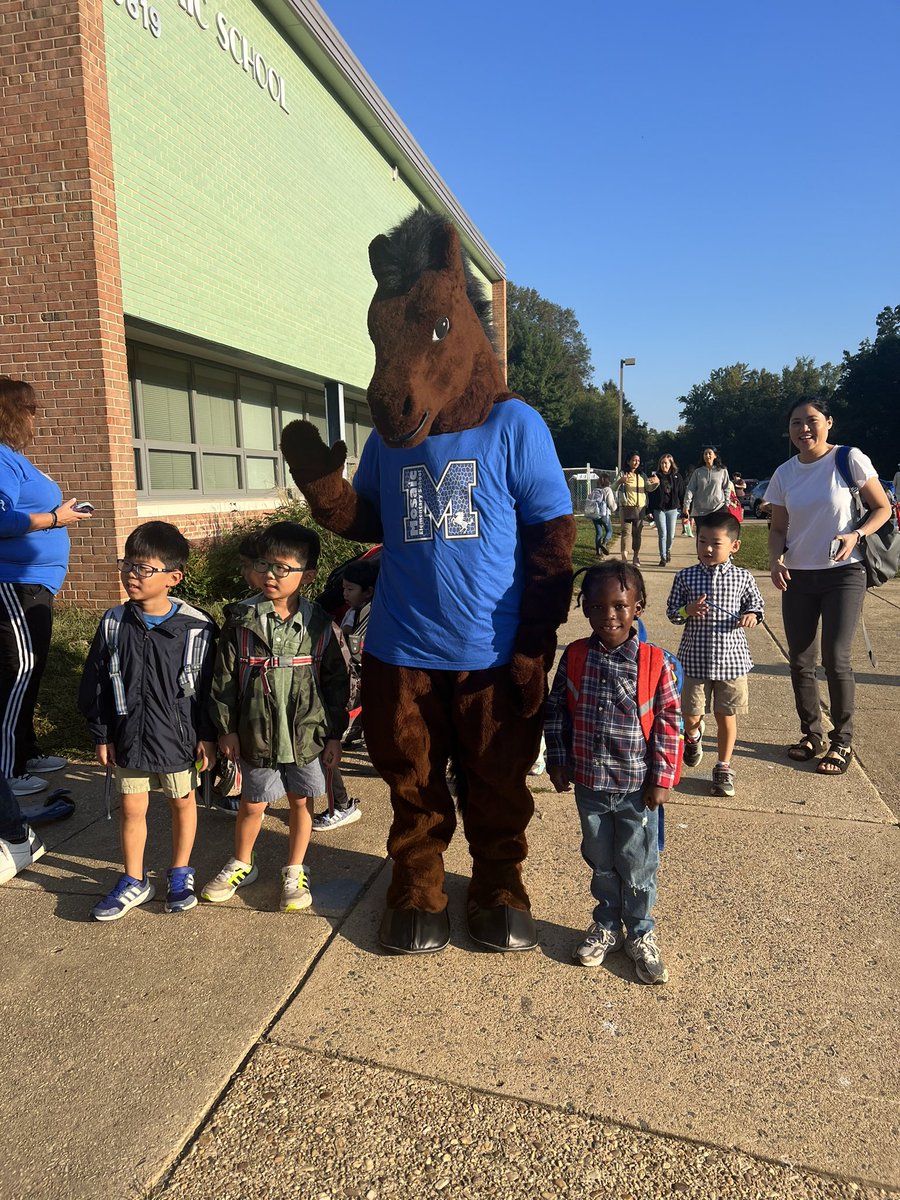 Me and my pal Musty the Mustang, and a few friends. Love our community! Love our school! 💙❤️🌈