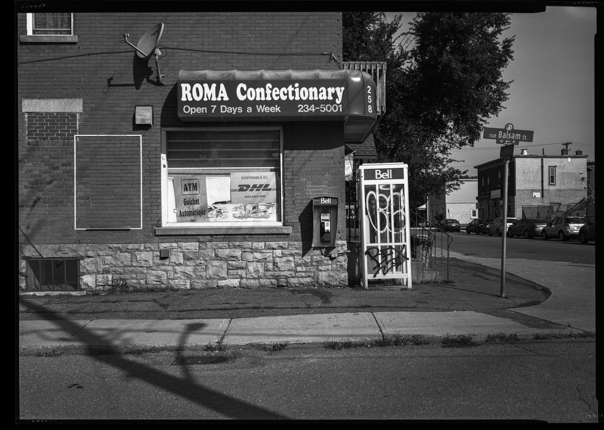 And yet another payphone. Actually two. In an arrangement I've never seen previously among the 120 or so that I've shot. A little kiosk for fine weather, a full-on phone booth for winter. Rochester Street, Ottawa. (Chamonix45N1, 180m f5.6 APOSymmar, @KodakProFilmBizTXP 320)