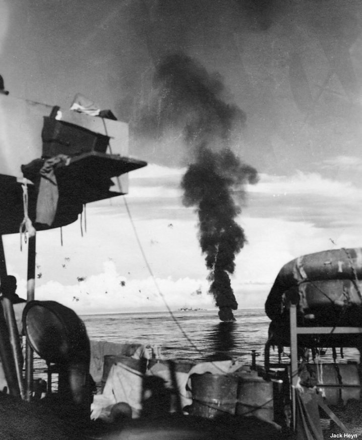 A downed Japanese plane burns in the water between Leyte and Mindoro in the Philippine Islands in December, 1944. #History #WWII