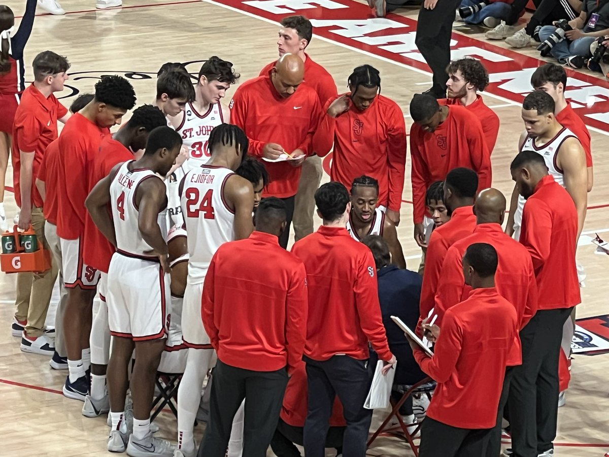 Red Storm in the huddle with Coach Pitino. They lead 27-17 halfway through the 1st.