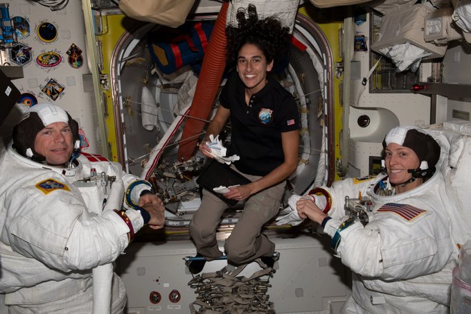 NASA astronaut Jasmin Moghbeli (center) assists astronauts Andreas Mogensen (left) from ESA (European Space Agency) and Loral O’Hara (right) from NASA as they try on their spacesuits and test the suits’ components aboard the International Space Station’s Quest airlock in preparation for an upcoming spacewalk. NASA