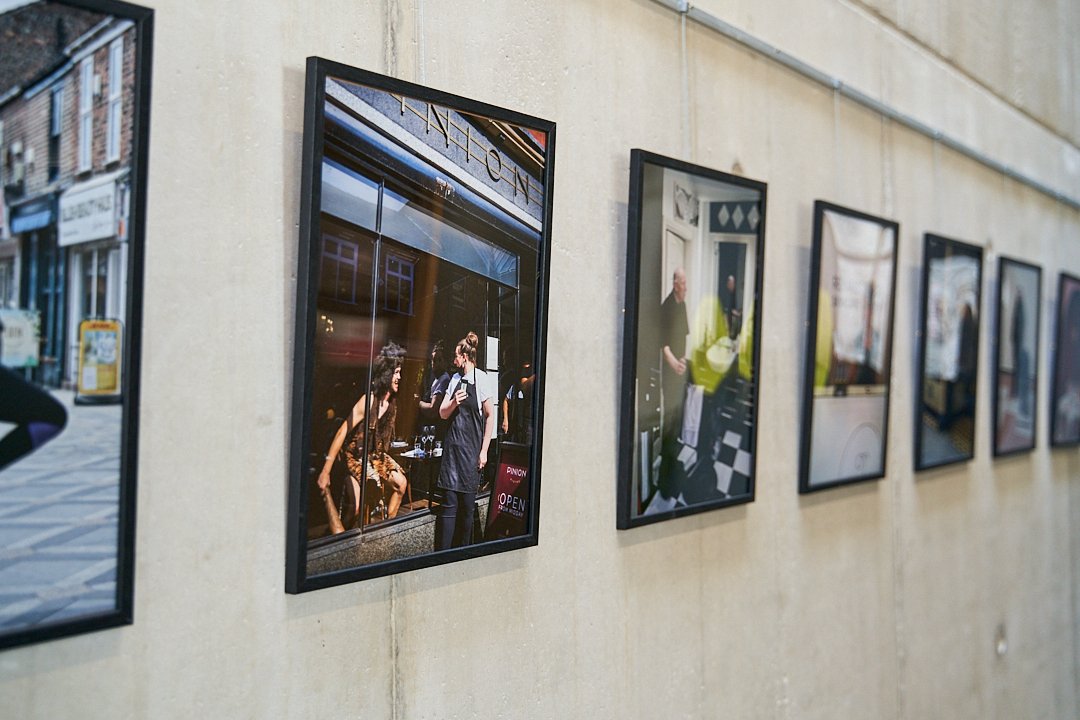 OpenEyeGallery's tweet image. A Portrait Of The High Street #Prescot is part of our current exhibition. It's also on display  in the @ShakespeareNP cafe area and on Eccleston Str. It's essential for the local community to see themselves represented and to see the photos exhibited in the place where they live!