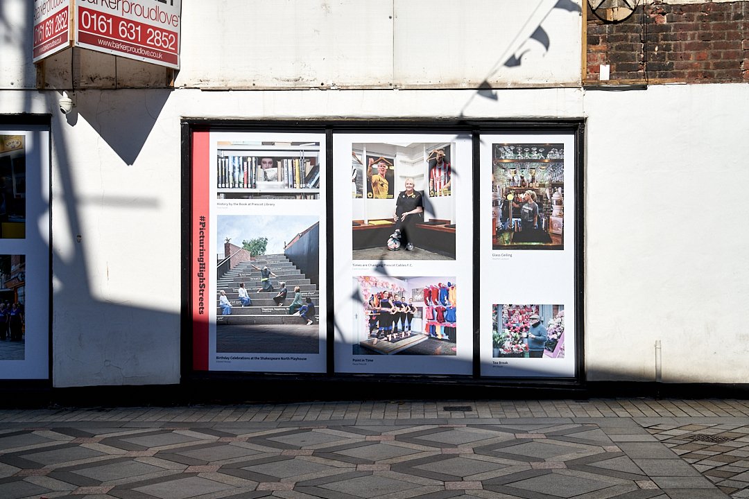 OpenEyeGallery's tweet image. A Portrait Of The High Street #Prescot is part of our current exhibition. It's also on display  in the @ShakespeareNP cafe area and on Eccleston Str. It's essential for the local community to see themselves represented and to see the photos exhibited in the place where they live!