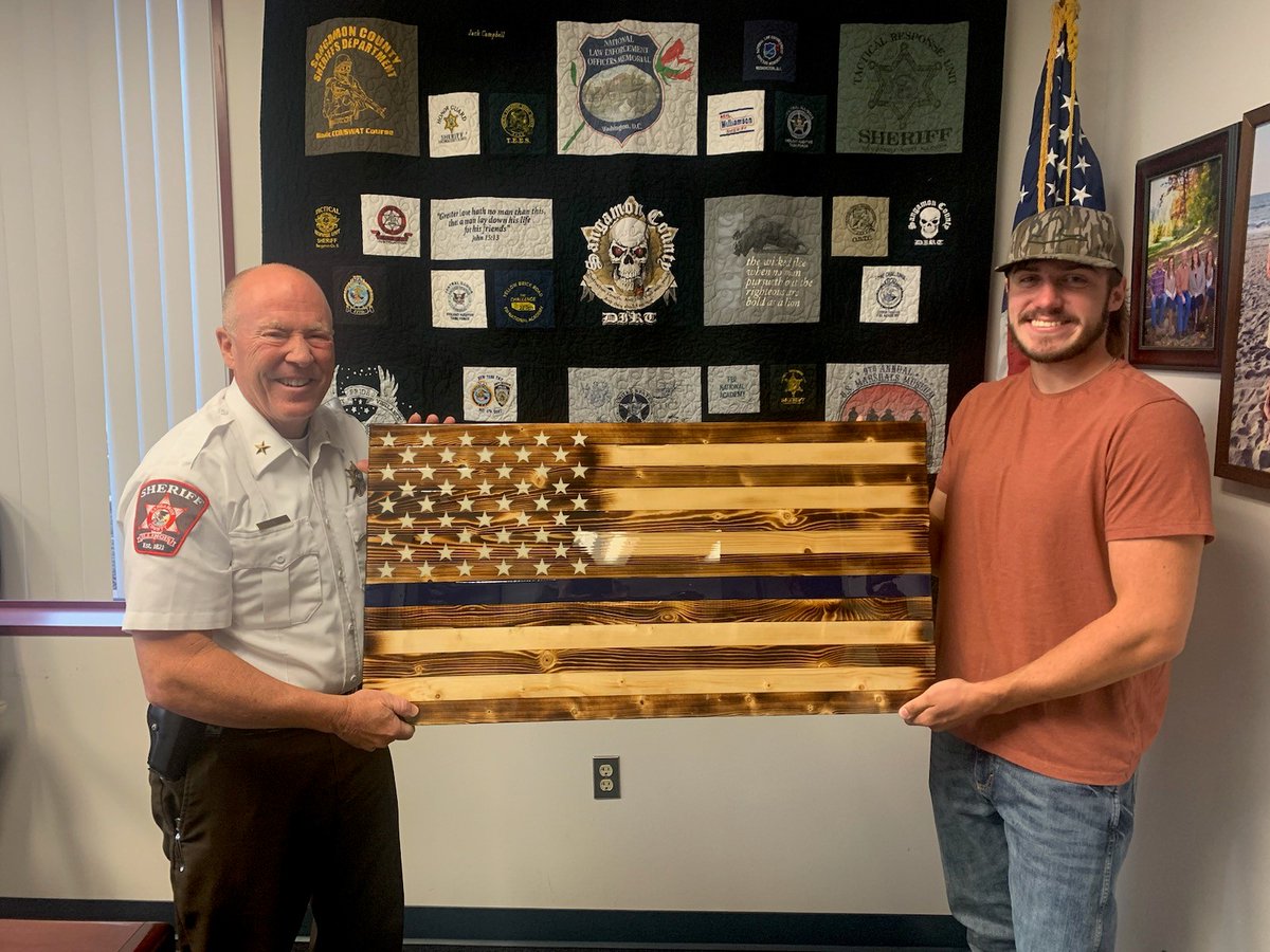 Sangamon County Sheriff Jack Campbell was presented with this handmade wooden flag by Illiopolis resident Jasyn Wood.