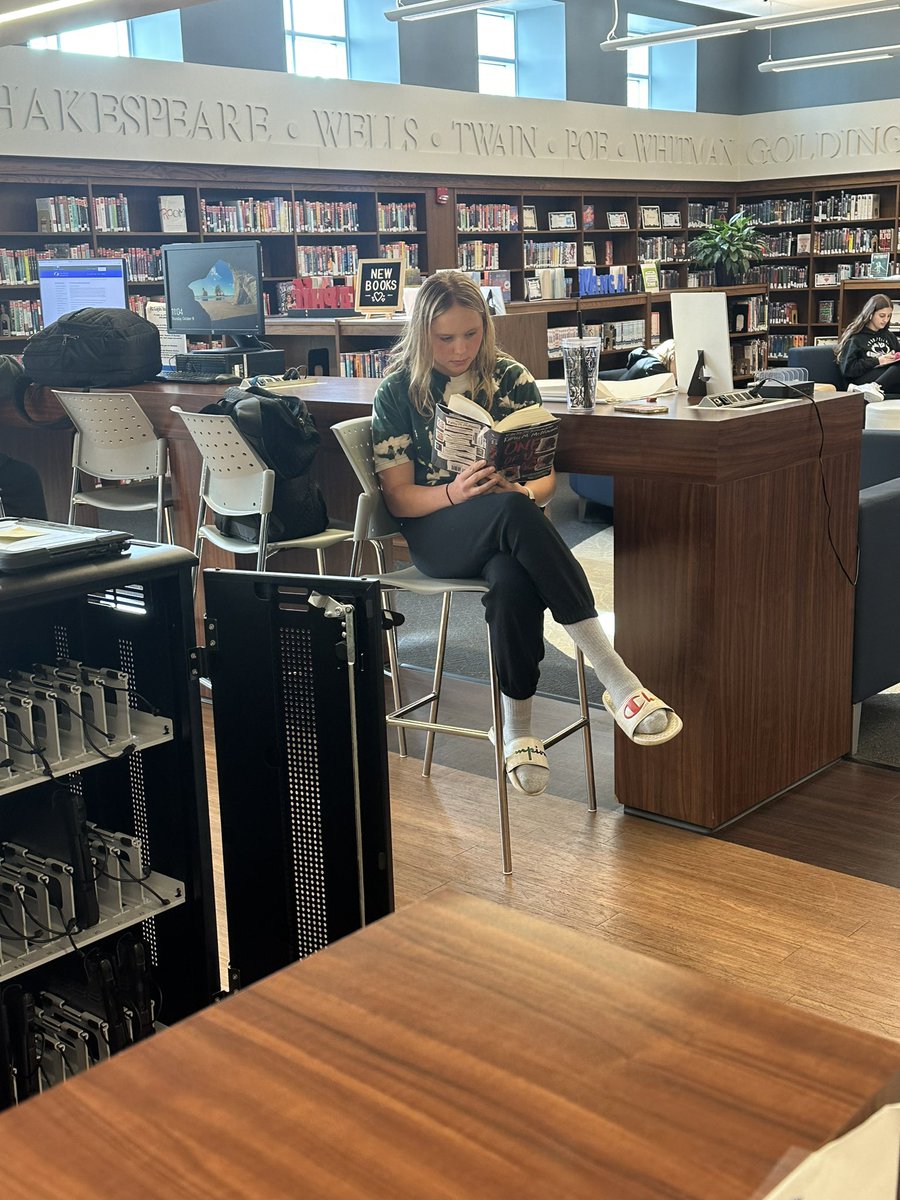 wolskilibrary's tweet photo. A couple students loving their books! https://t.co/x8EQJeEw0F
