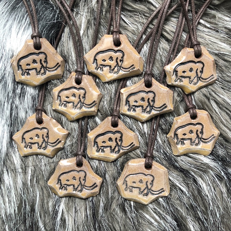 cavetoonist's tweet photo. I found the last of my Rouffignac inspired mammoth pendants! They're up in my Kofi shop! The pin vault will also be open briefly as I'm trying to gather some funds for school at the moment. 🙃 https://t.co/zr2g5mht9S