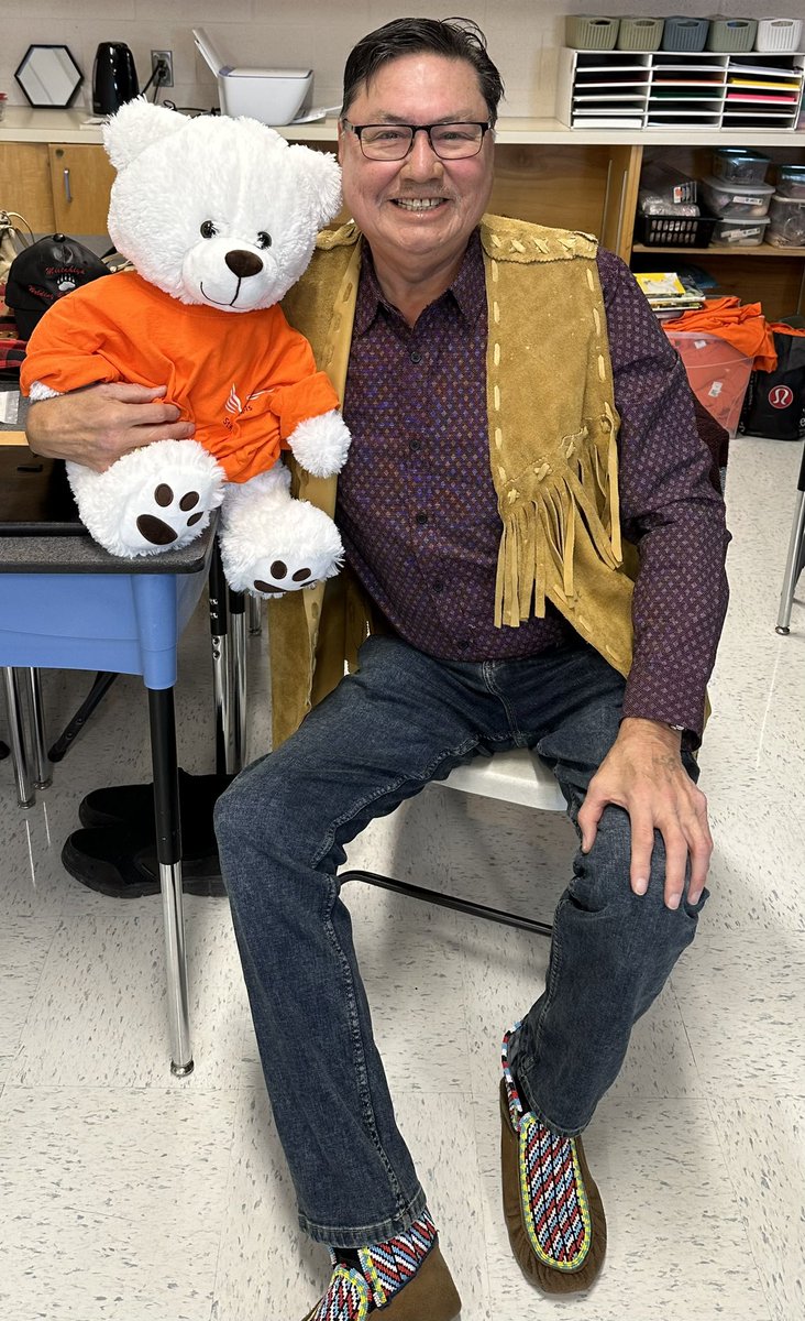 MsKylaC's tweet photo. Mosom Robert sharing important teachings about the bear &amp; giving our @SpiritBear Reconciliation Ambearrister a name: meet Achak-Maskwa 🧸🧡 #fmcsd #fncaringsociety #ymm https://t.co/IUDT8k6H84