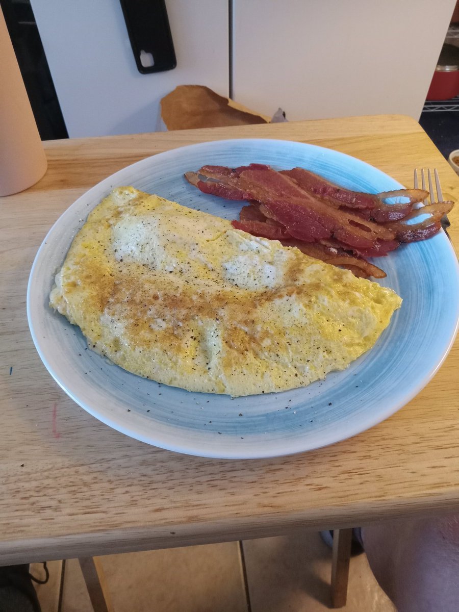 Because my physical therapist tried killing me with the work he had me doing, I am eating late. Today I have a mozzarella cheese omelet and bacon