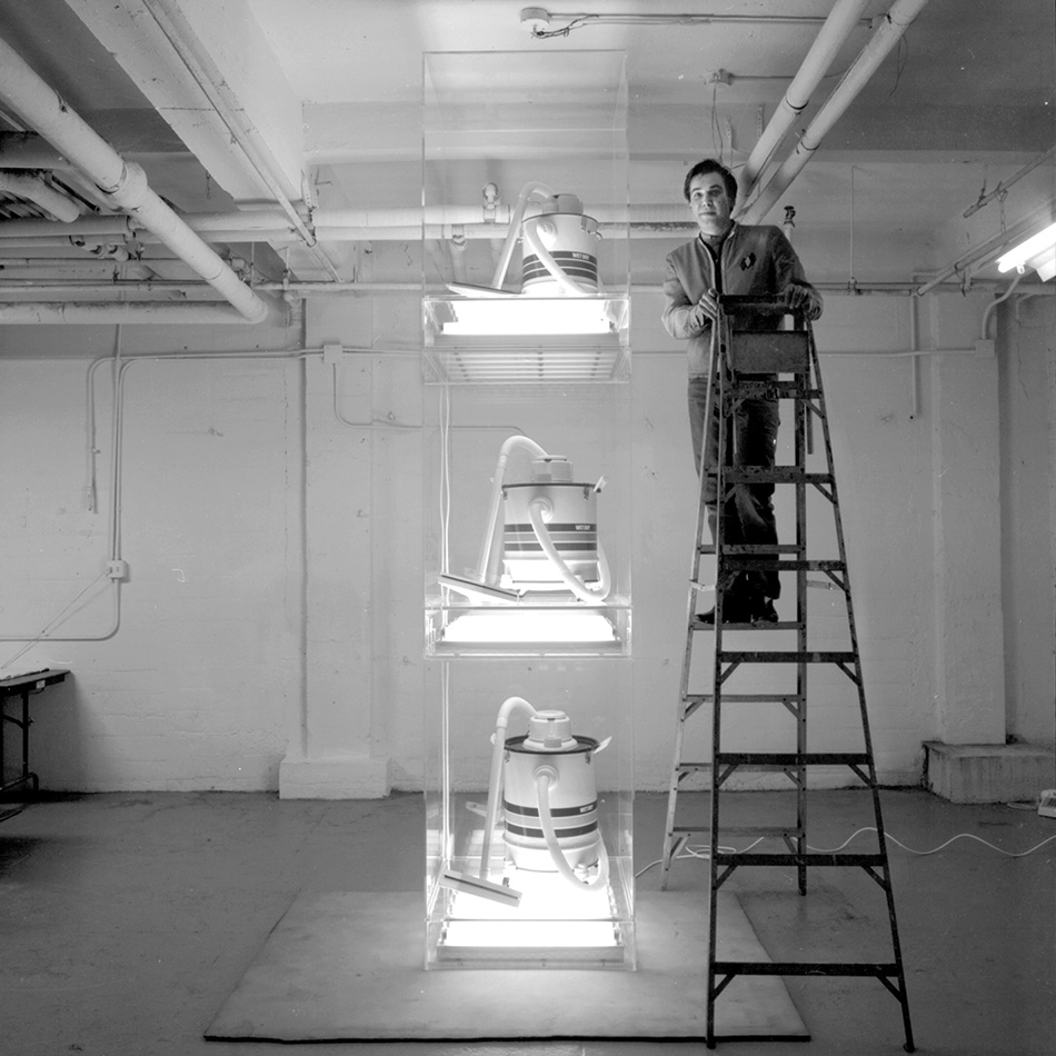 Here’s a photo of me in my studio on West 16th Street when I just completed New Shelton Wet/Drys Tripledecker in 1981. #jeffkoons #tripledecker #encased #thenew #vacuums #wetdrys #newyork #flourescentlights #encased #anthropomorphic #sculpture #newness #art #artist @DMArtCenter