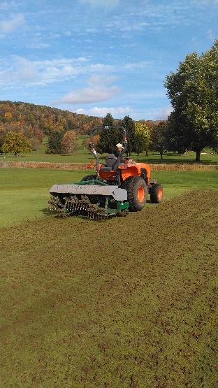 Beautiful day for aeration at Traditions at the Glen. Andre and Son in action again!