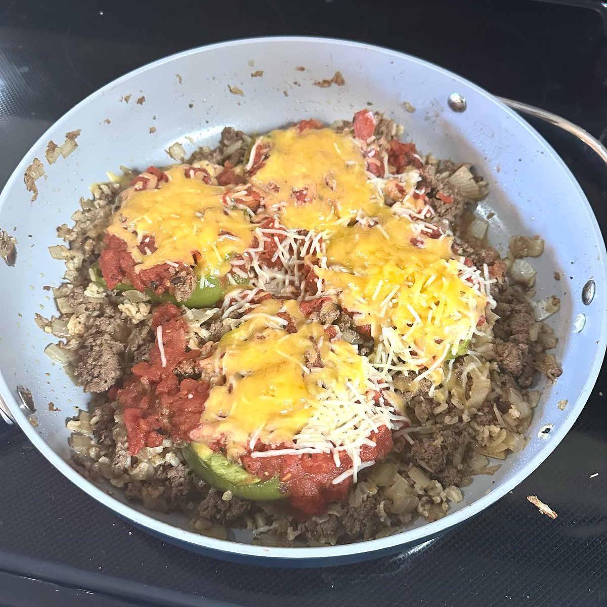 Stuffed green peppers tonight, still working on my spice mix and had to go with cheddar cheese 'cause tomorrow is grocery day.