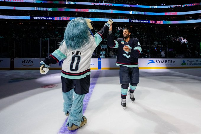 Buoy and Bellemare giving the highest of fives after a kraken win on the ice.