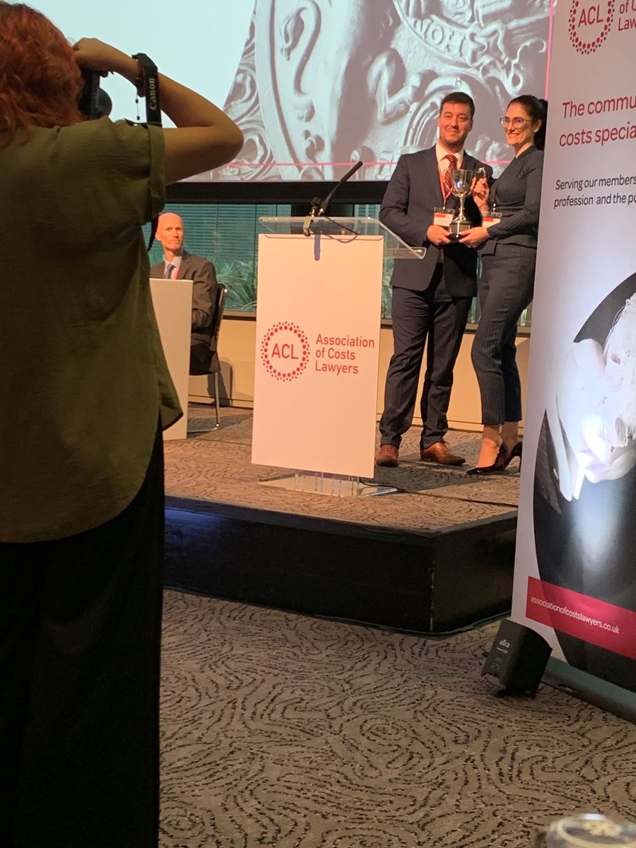 ACL chair Jack Ridgway awards annual President's Cup to <a href="/EricaBedford/">Erica Bedford</a> of <a href="/Kings_Chambers/">Kings Chambers</a> for her contribution to the association (such as judging students' moots) and the costs profession (founded the Women in Costs group)