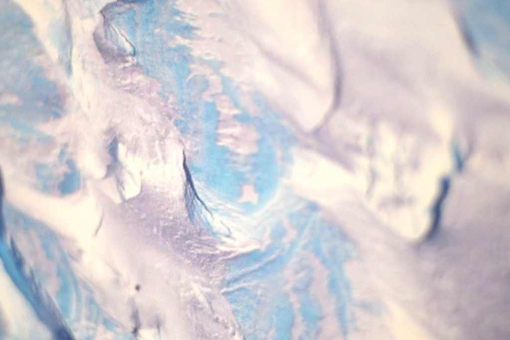 Tapestry: Pristine. This depicts Antarctic ice, which is studied by researchers to understand climate change and the potentially irreversible damage which directly contributes to rising sea levels.