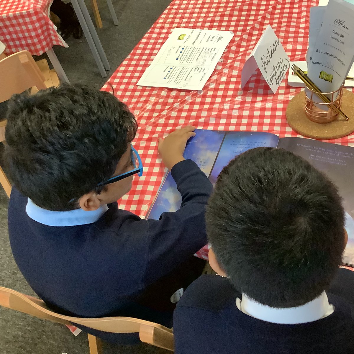 Primary_StJohns's tweet photo. Today, Year 5  have enjoyed working with students from Year 2. We shared some of our favourite books from our reading cafe and read with our new friends. #readingforpleasure #SJCReader https://t.co/udhka4hz2J
