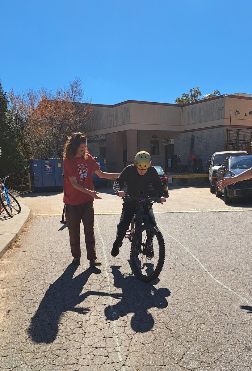 EC staff and students at Asheville High School connected to teach Ms. Baer's students about bike safety and the 'rules of the road'. What an amazing experience as these students used the mini-bike course designed for the activity. #ACSCougarPride